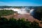 Rainbow over gorgeous waterfalls of Iguazu, Brazil