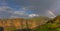 Rainbow over green mountains