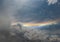 Rainbow over grey cloudy sky