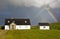 Rainbow over the houses in the Irish countryside, Ireland, Europe.