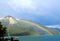 Rainbow over mount Jochberg and lake Walchensee Bavaria, Germany