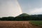 Rainbow over the ripe wheat field
