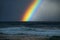 Rainbow over the rough Pacific Ocean