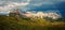 The rainbow over the seceda ridge, idyllic mountain scenery in the Dolomites Alps with Majestic Peaks, Overcast sky and Rainbow.