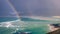 A rainbow over the turquoise sea on the Isle of Harris