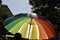 Rainbow-patterned umbrella in a gay pride parade