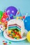 Rainbow pinata cake with candies - birthday background, card, concept