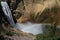 Rainbow and the power of the waterfall Lower Falls in Yellowstone