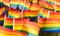 Rainbow pride flags blowing in the wind blurred by long exposure
