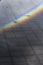 Rainbow reflected on a puddle