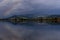 The rainbow is reflected in the waters of Lake Massaciuccoli, Lucca, Tuscany, Italy