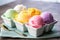rainbow sherbet ice cream in a pastel-colored dish