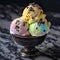 rainbow sherbet ice cream sundae bowl with chocolate chip toppings on top of marble table