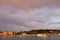 Rainbow in the sky over the town of Rovinj, Croatia, with the Adriatic Sea and some boats sailing