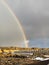 Rainbow spanning the gap between the North American and Eurasian continental plates in western Iceland