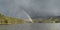 Rainbow & Storm cloud over Loch an Eilein in Scotland.