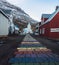 Rainbow stripes on pavement leading up to the Seydisfjordur Church in Iceland