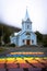 Rainbow stripes on pavement leading up to the Seydisfjordur Church in Iceland