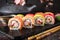 Rainbow Sushi Roll with salmon, eel, tuna, avocado, royal prawn, cream cheese Philadelphia, caviar tobica, chuka.