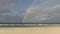 Rainbow touching the ocean, Palm Beach, Gold Coast, Australia.