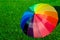 Rainbow umbrella on the grass