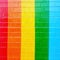 Rainbow wall painted background with copy space bright colors red orange yellow green and blue with brick texture