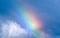 Rainbow and white clouds, symbol of hope