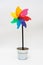 Rainbow windmill on a stick in a pot