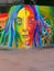 Rainbow womans face street art mural