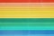 Rainbow wooden background from colourful painted wood planks