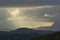 Rainclouds with sunray over the Scottish Highlands