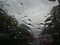 Raindrops forming streaks on a windshield