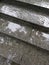 Raindrops on granite steps of outdoor staircase during rainy day