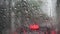 Raindrops run down on car windshield from inside view. Traffic jams during the heavy rain storm