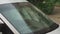 Raindrops on the windshield of a car close-up