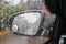 Raindrops on windshield in traffic jam