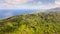 Rainforest on a large island, view from above. Forest massif on the hills of a tropical island.