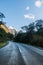 Rainforest road through valley with mountain views