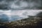 Raining above mountains in Sicily, Italy Dark rain clouds above the seashore