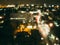 Raining cityscape at night from windows.