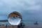 .raining on crystal balls beside the beach