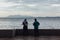 Raining in Park, Man and Woman are seeing Seascape and Cityscape from the Coast of George Town, Penang, Malaysia