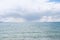 rainstorm in distance while at namtso lake in tibet