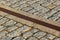 Rainwater drainage grid in a cobbled pavement