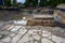 Rainwater filling the freshly dug out foundation of a new residential construction site