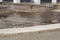 Rainwater passing over a wooden walkway due to heavy rains causing flooding in the town of BenicÃ ssim-BenicÃ¡sim, in CastellÃ³n.