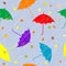 Rainy autumn background with umbrellas and leaves