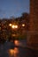 Rainy blurred autumn day concept. Raindrops on glass on night lights background