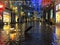 Rainy    in the City Christmas Tallinn Old town street night  light people walking with umbrellas rain drops reflection on window