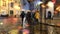 Rainy  city night light  street reflection people walk  Tallinn old town  medieval  buildings vitrines  blurred light red yellow